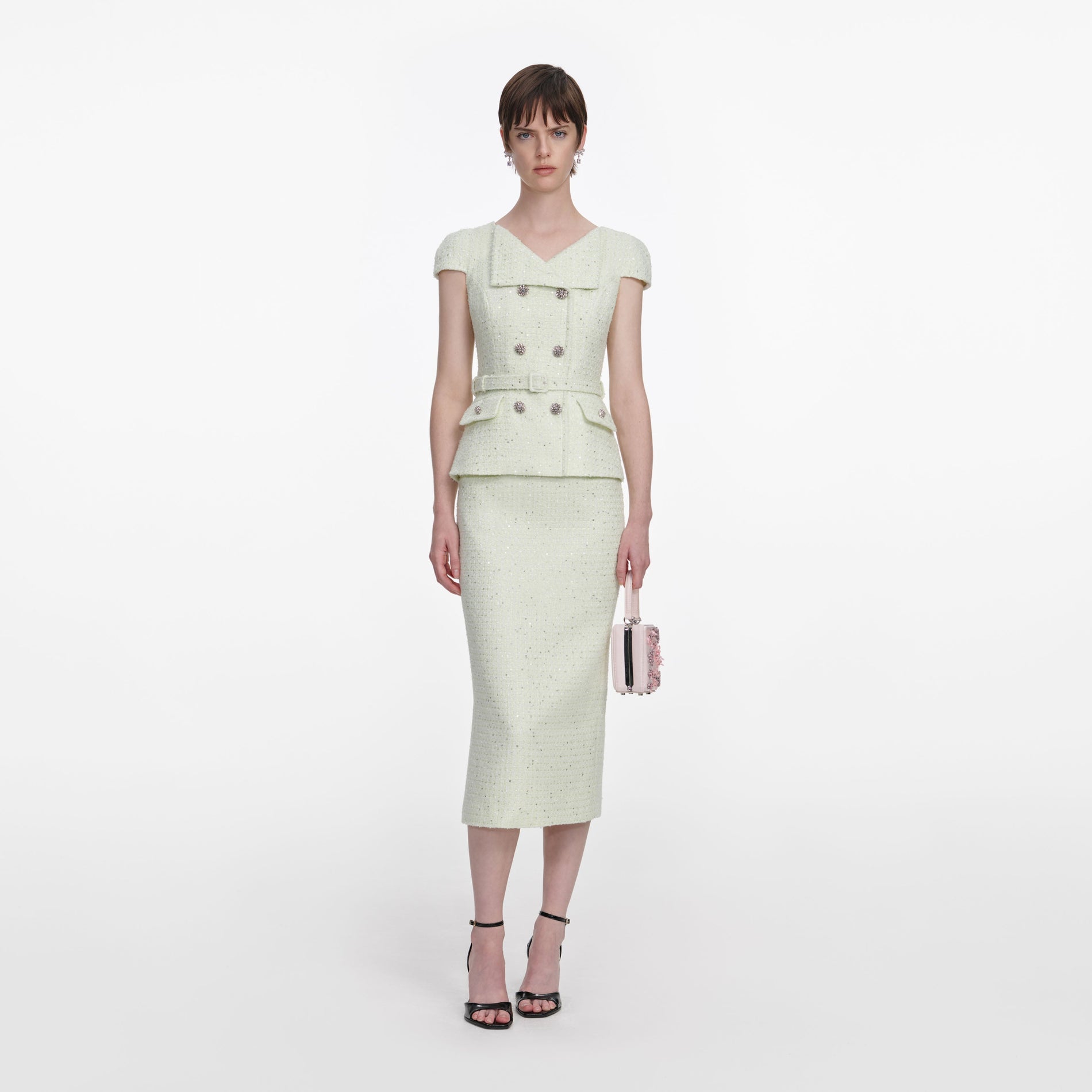 Front view of a woman wearing the Lime Boucle Midi Dress