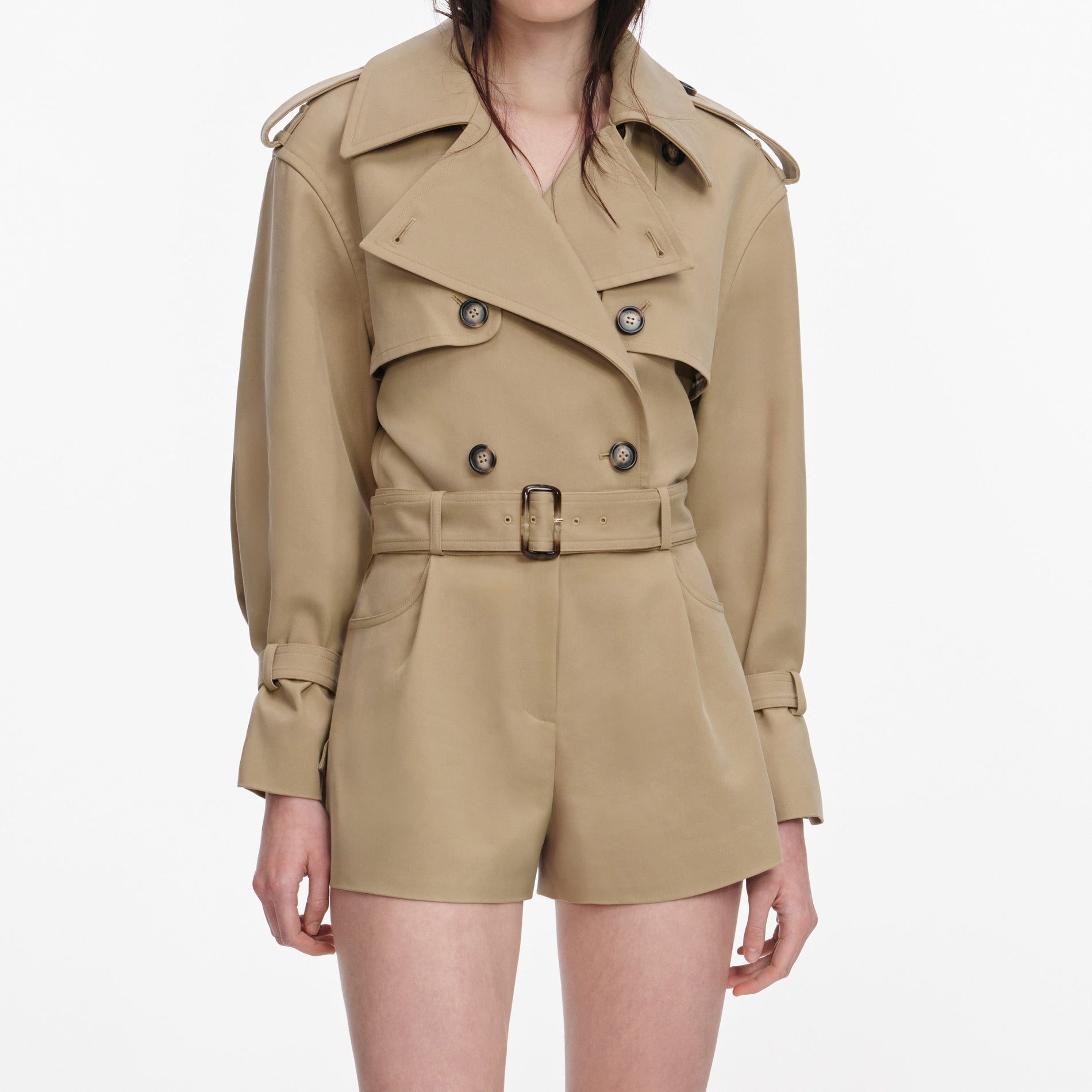 A close up of a woman wearing the Beige Cotton Playsuit