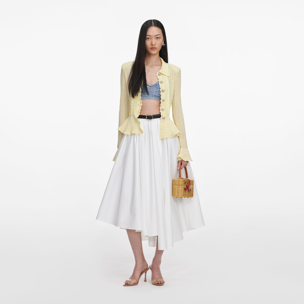 Front view of a woman wearing the Yellow Pointelle Cardigan