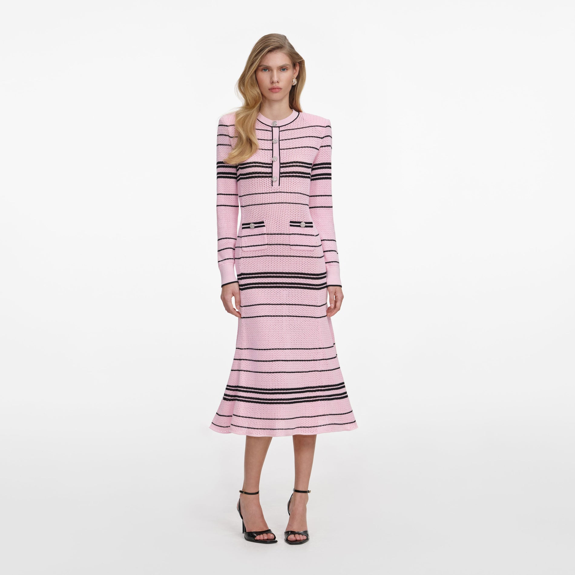 Front view of a woman wearing the Pink Stripe Knit Midi Dress