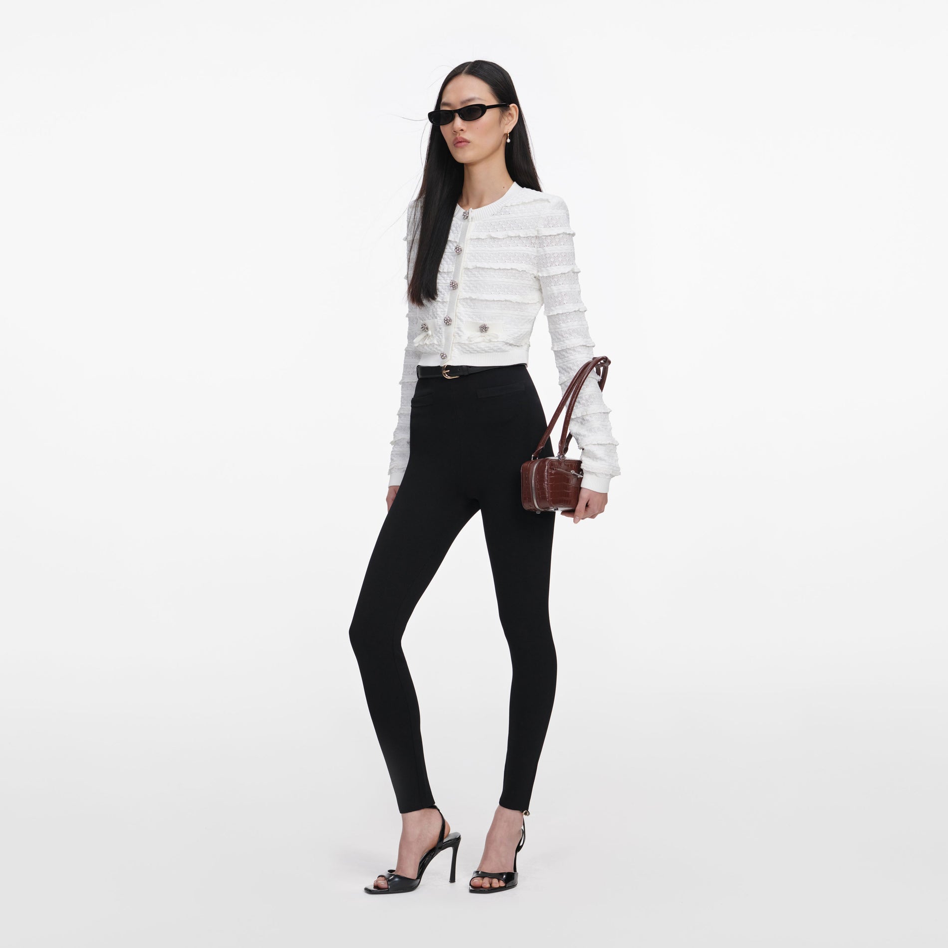 Side view of a woman wearing the White Pointelle Diamante Cardigan