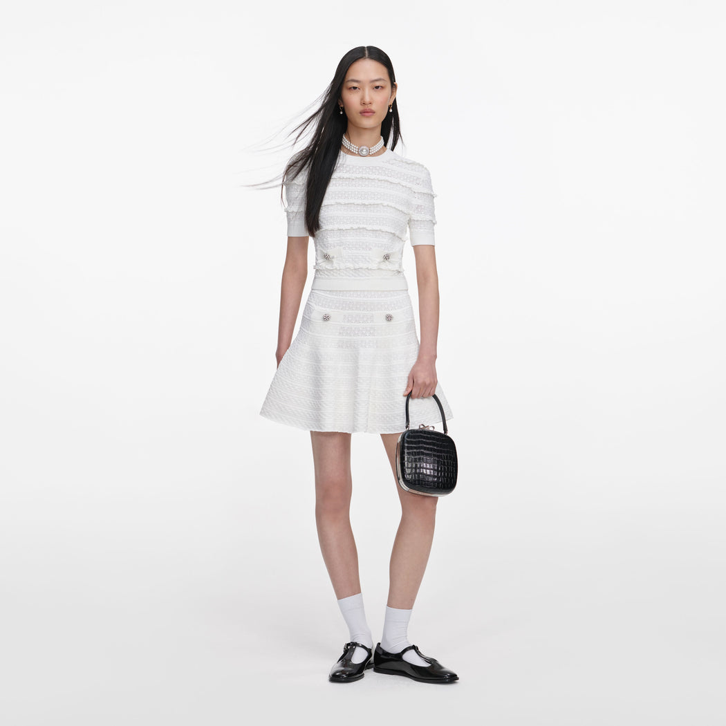 Front view of a woman wearing the White Pointelle Knit Top