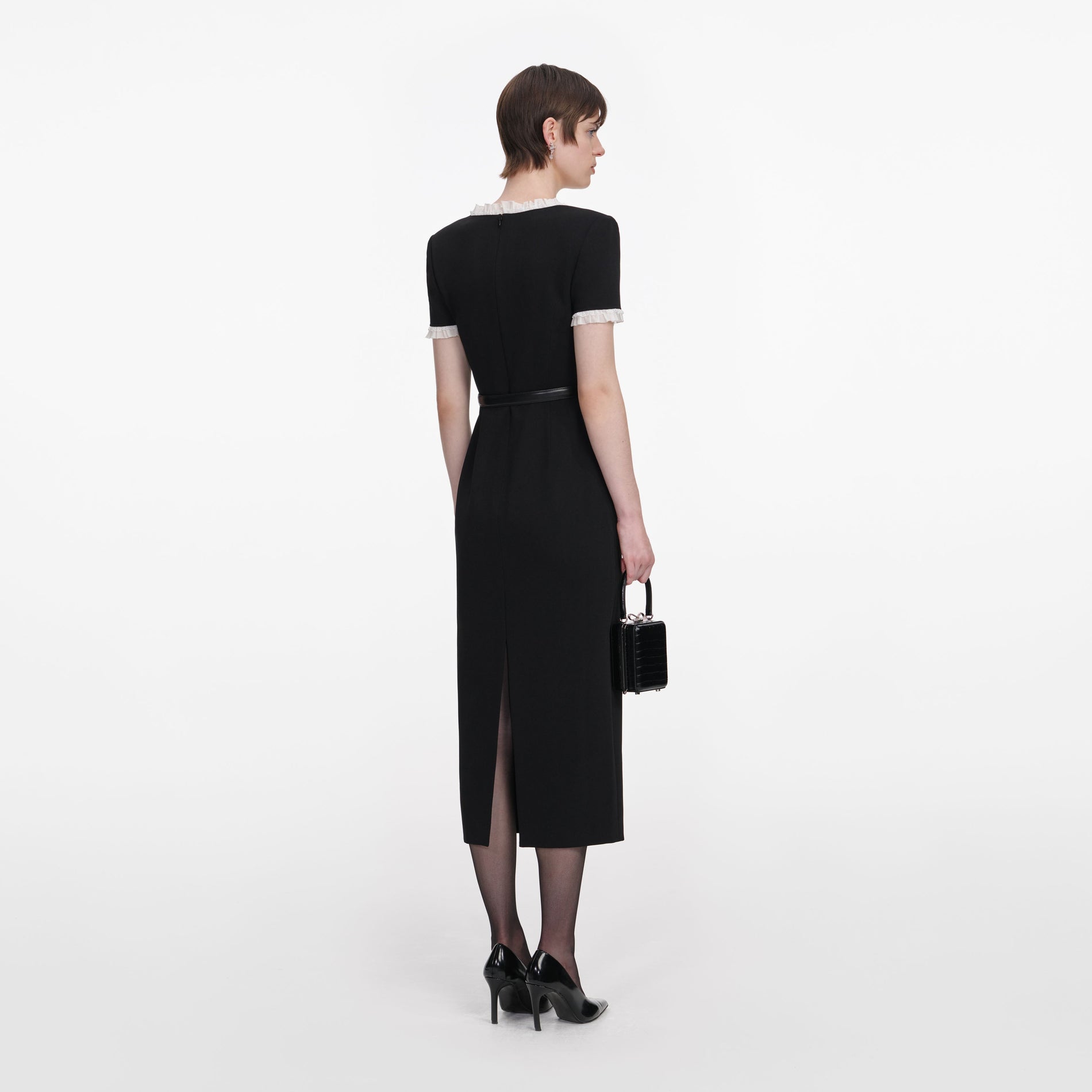 Back view of a woman wearing the Black Crepe Contrast Frill Midi Dress