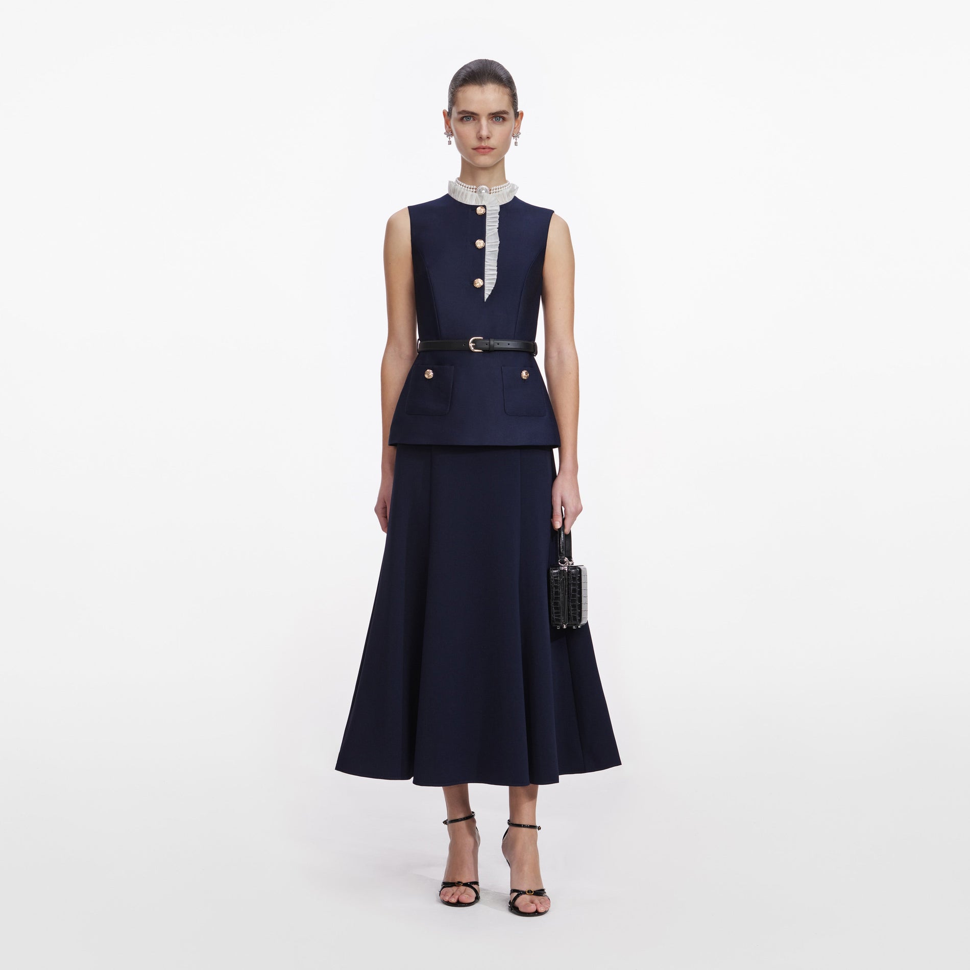 A close up of a woman wearing the Navy Taffeta Contrast Frill Midi Dress