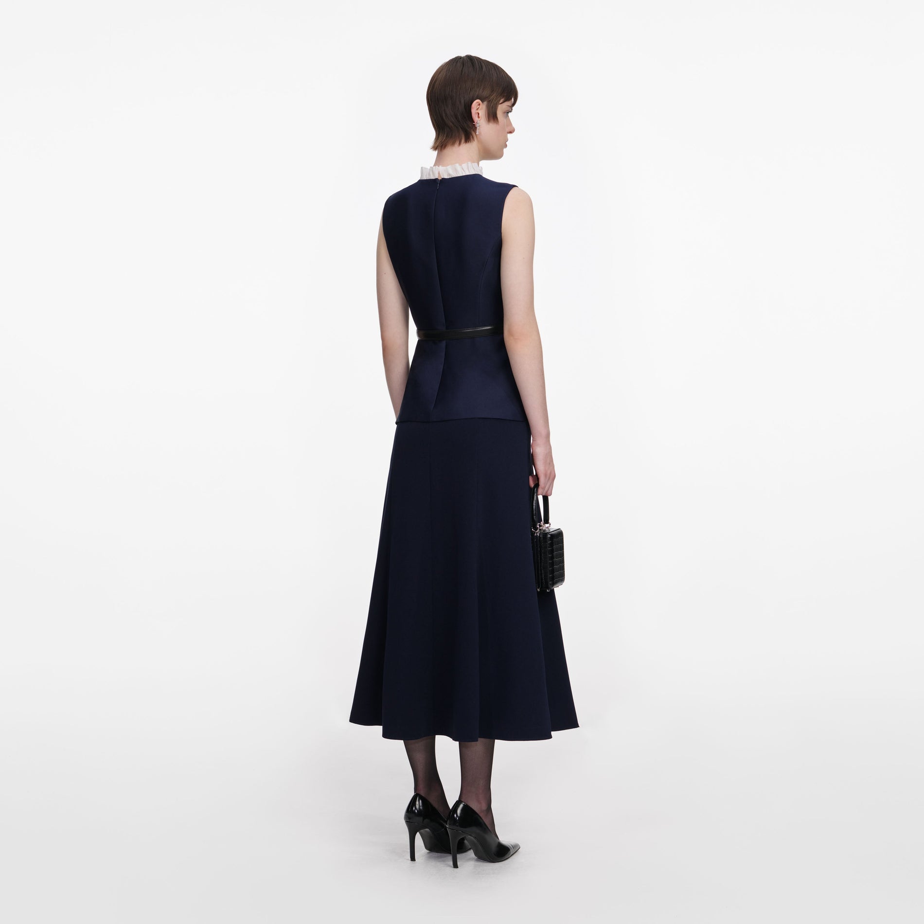 Back view of a woman wearing the Navy Taffeta Contrast Frill Midi Dress