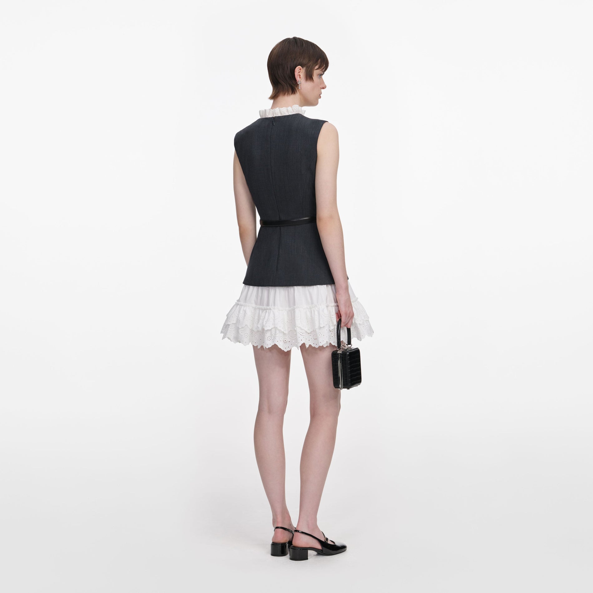 Back view of a woman wearing the Grey Tailored Cotton Frill Mini Dress