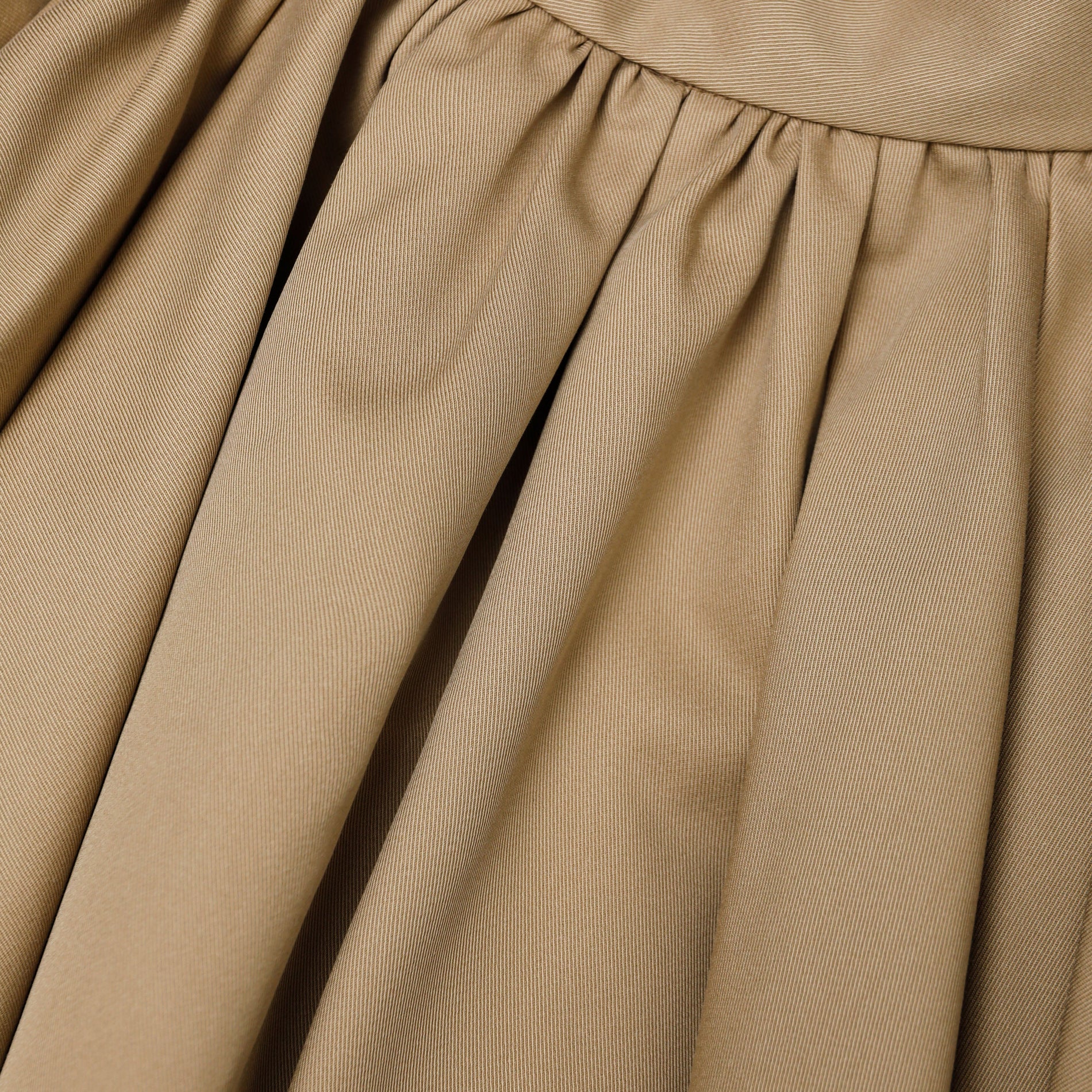 A close up of the fabric for the Tan Cotton Mini Skirt