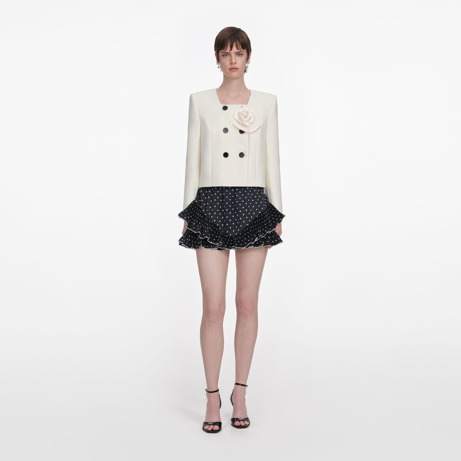 Front view of a woman wearing the Cream 3D Flower Jacket