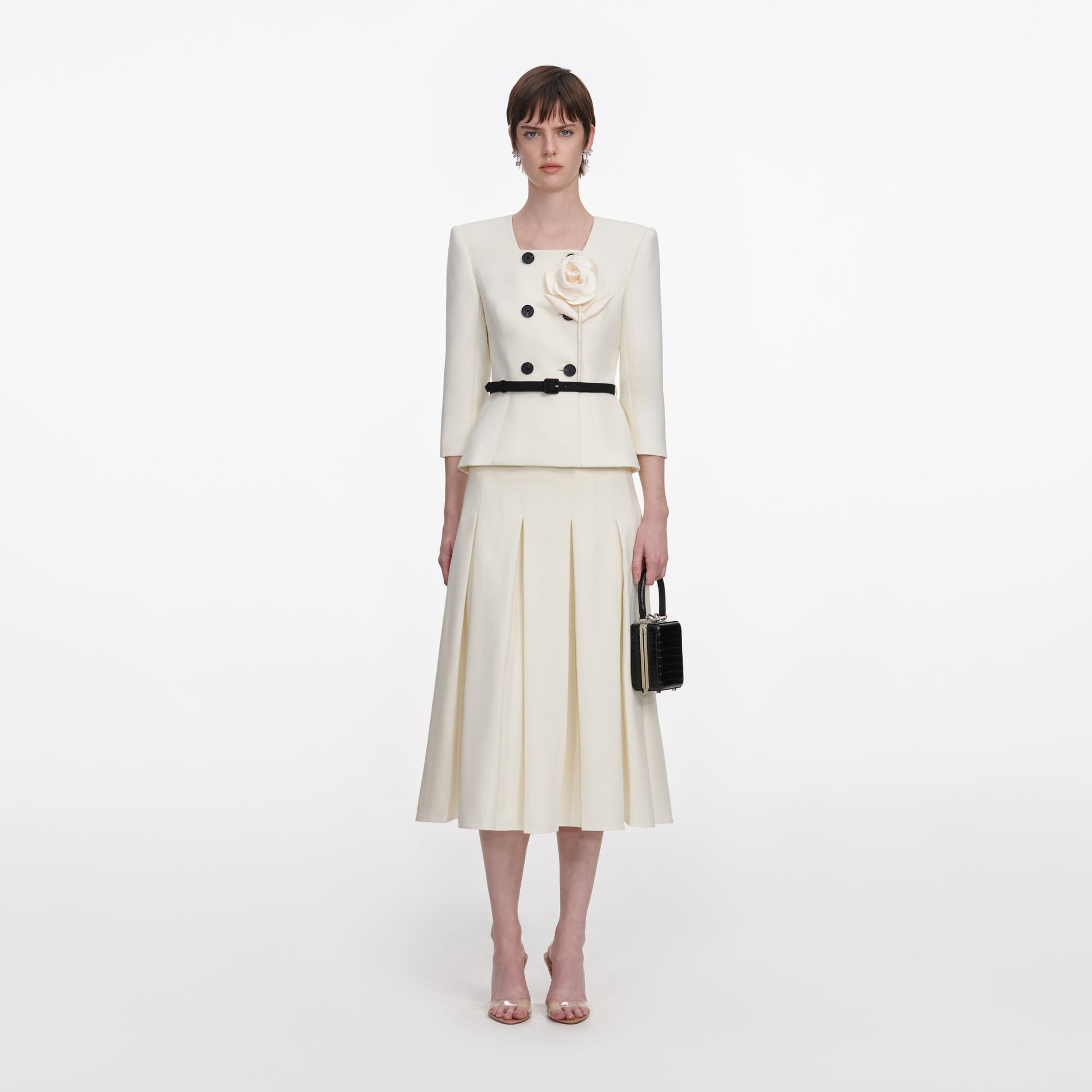 Front view of a woman wearing the Cream 3D Flower Tailored Midi Dress
