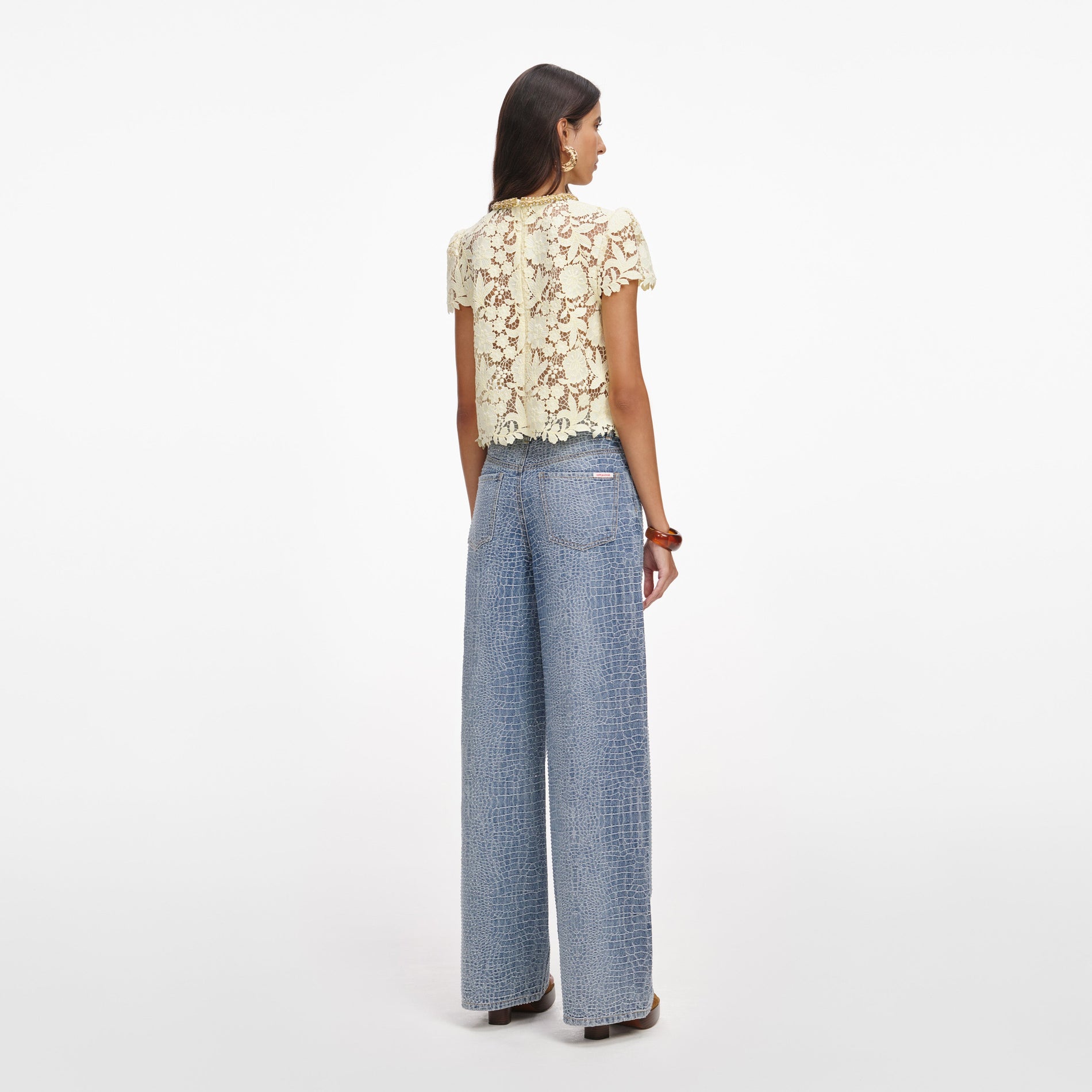 Back view of a woman wearing the Yellow Lace Top