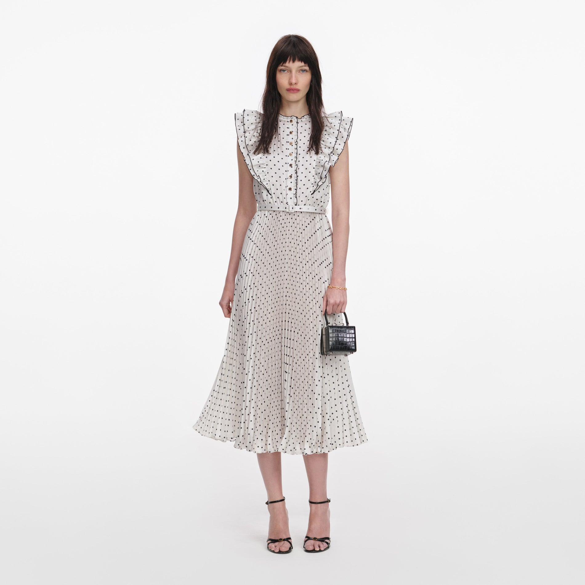 Front view of a woman wearing the Cream Ramie Polka Dot Midi Dress