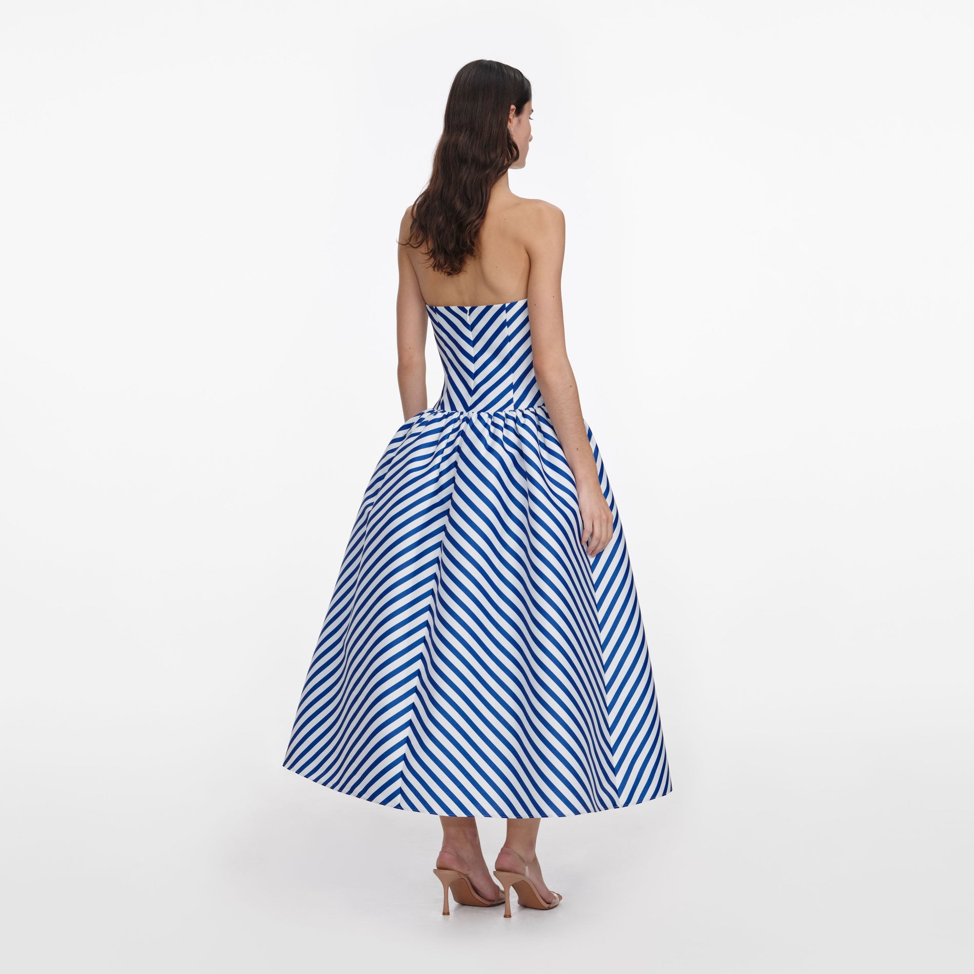 Back view of a woman wearing the Navy Stripe Taffeta Midi Dress