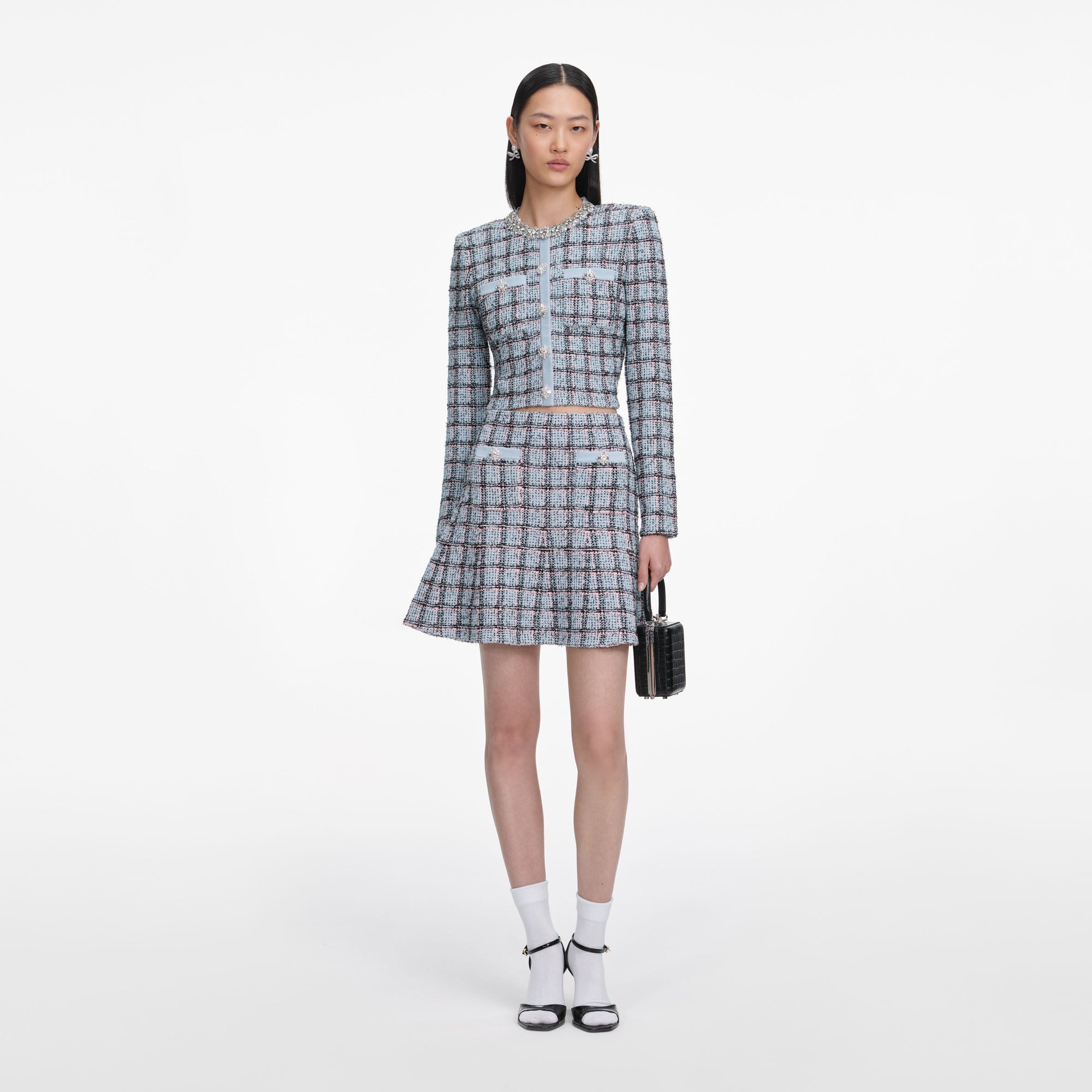 Front view of a woman wearing the Blue Check Knit Mini Skirt