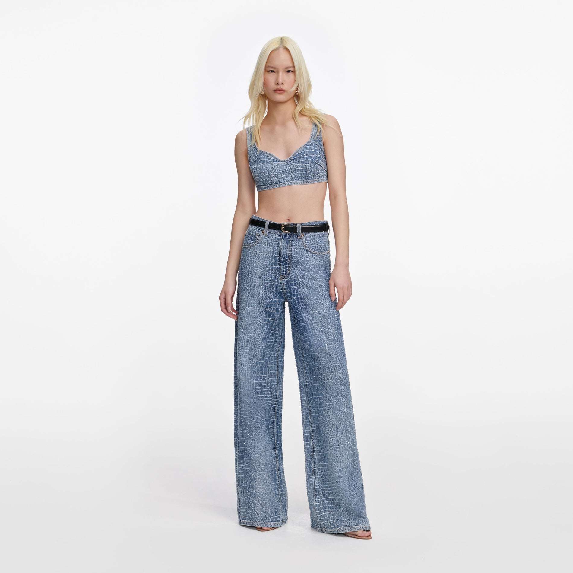 Front view of a woman wearing the Rhinestone Croc Effect Wide Leg Jeans