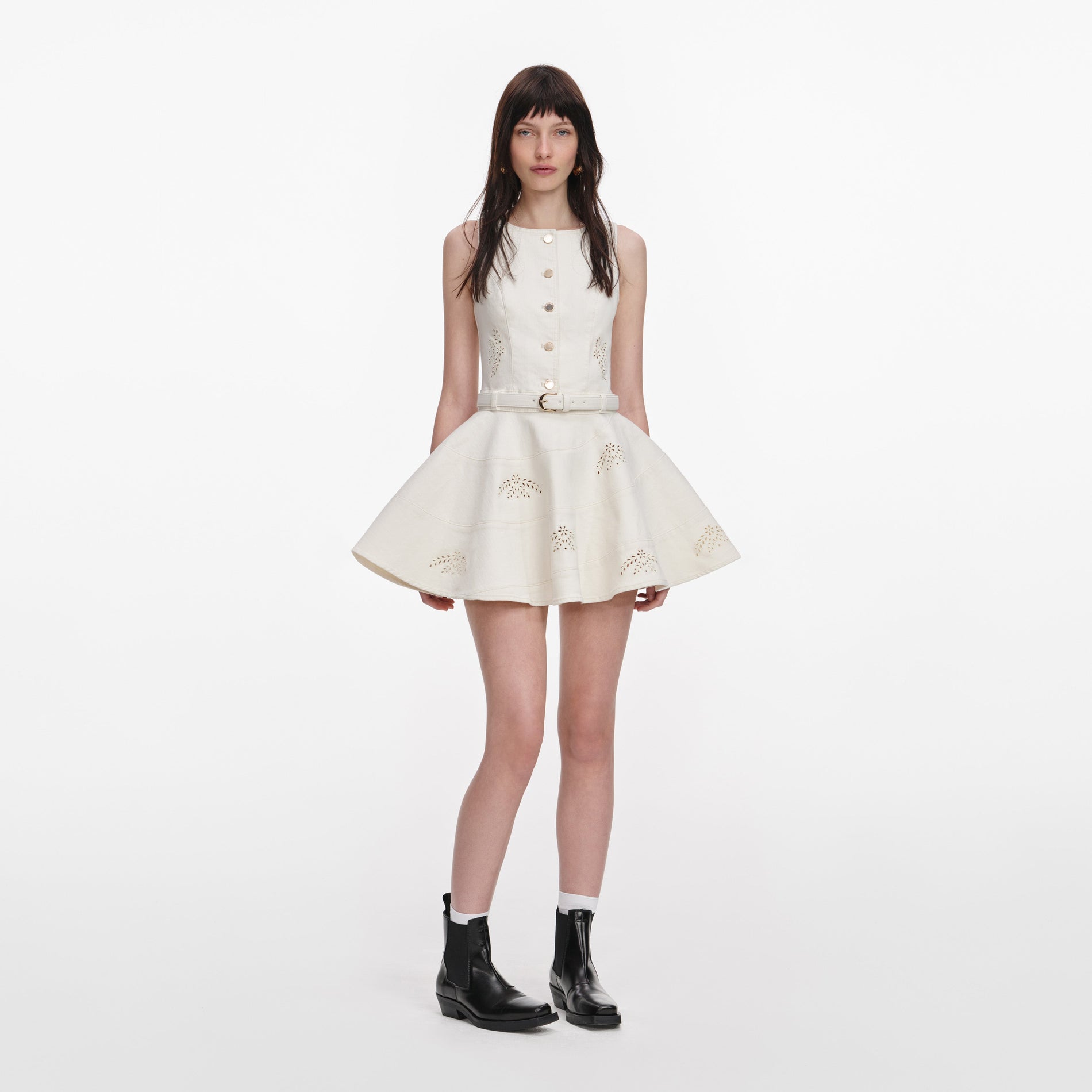 Front view of a woman wearing the Cream Broderie Denim Sleeveless Mini Dress