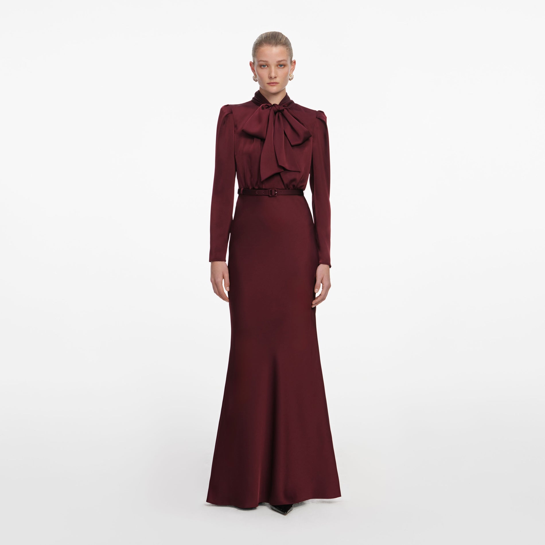 Front view of a woman wearing the Burgundy Tie Neck Satin Maxi Dress