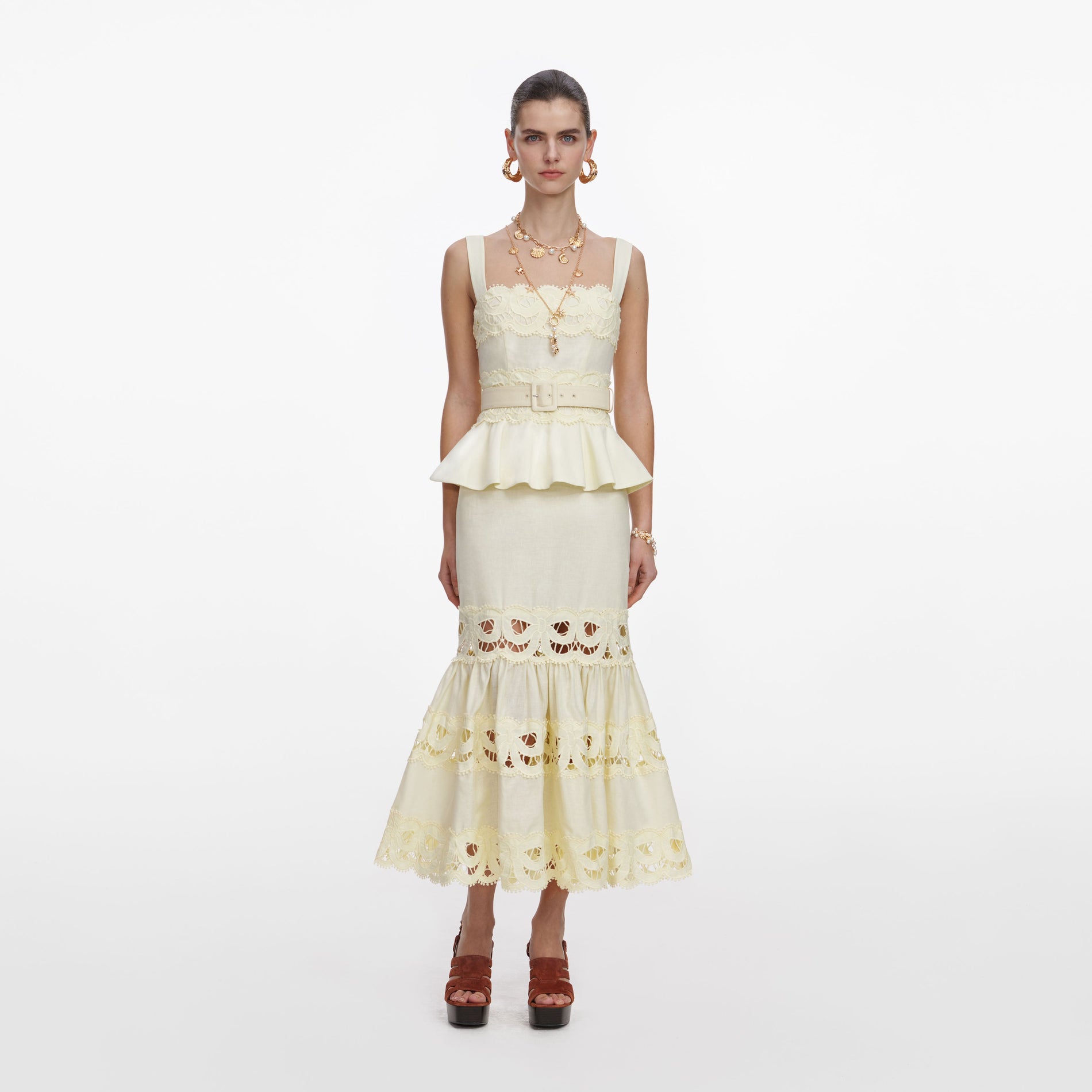 Front view of a woman wearing the Yellow Linen Peplum Midi Dress