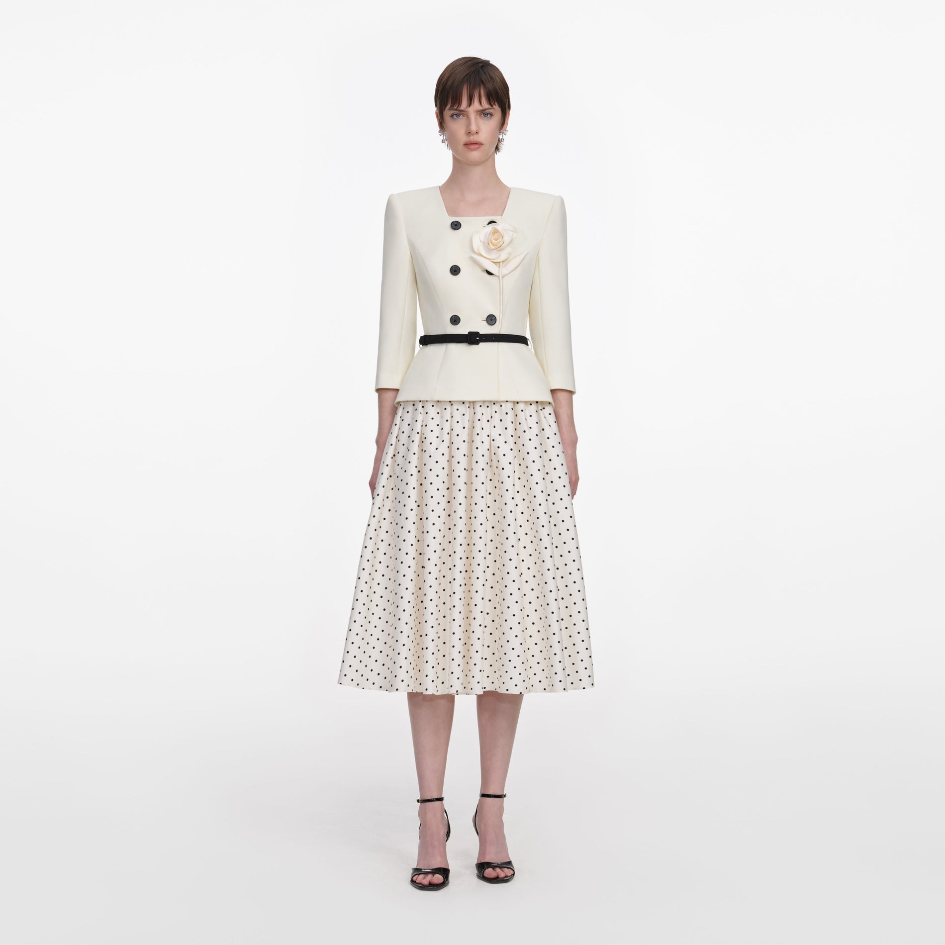 Front view of a woman wearing the Cream 3D Flower Polka Dot Midi Dress