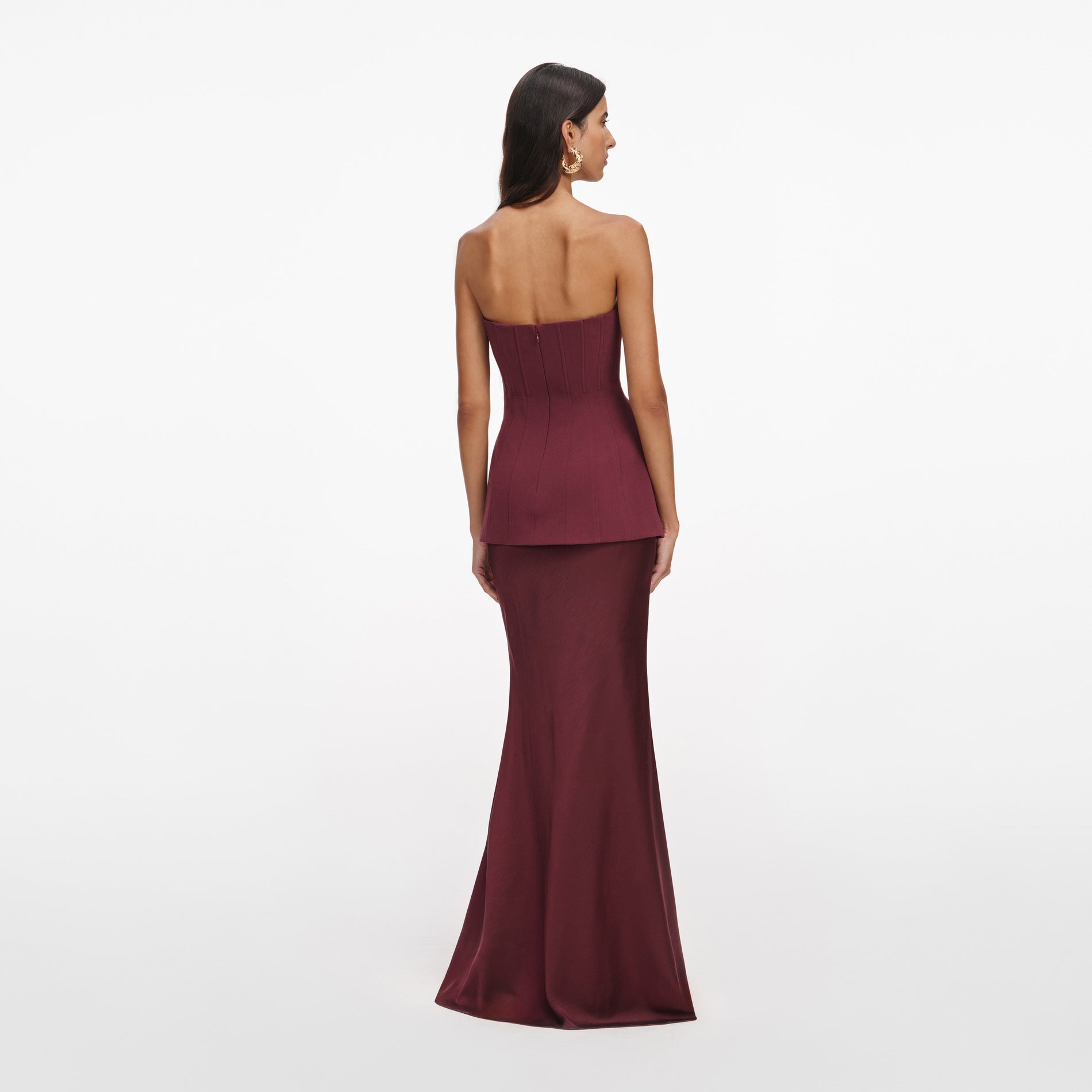 Back view of a woman wearing the Burgundy Bandeau Maxi Dress