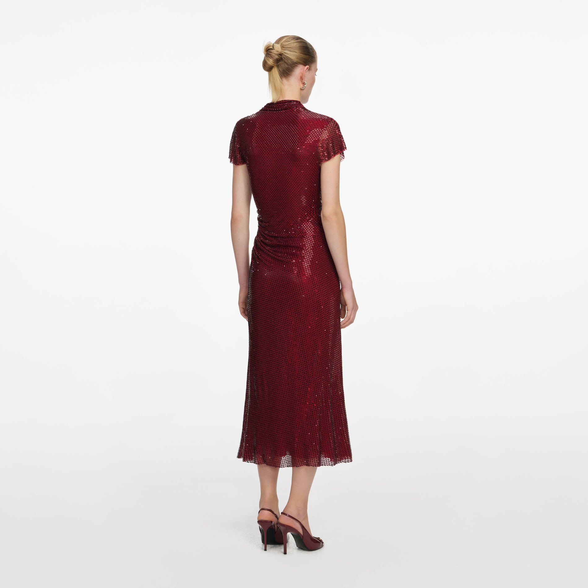 Back view of a woman wearing the Red Rhinestone Drape Midi Dress