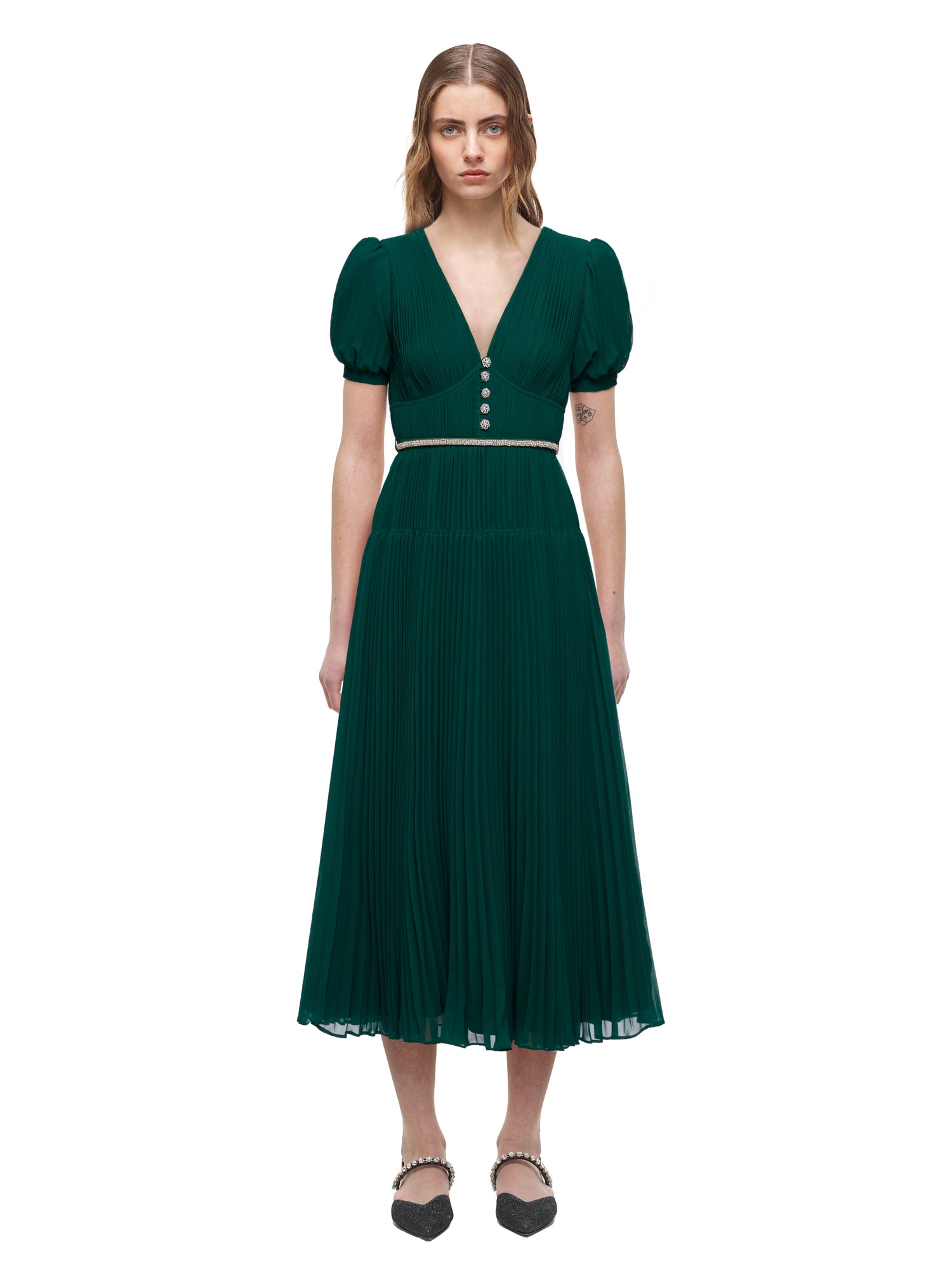 A woman wearing the Deep Green Chiffon Pleated Midi Dress