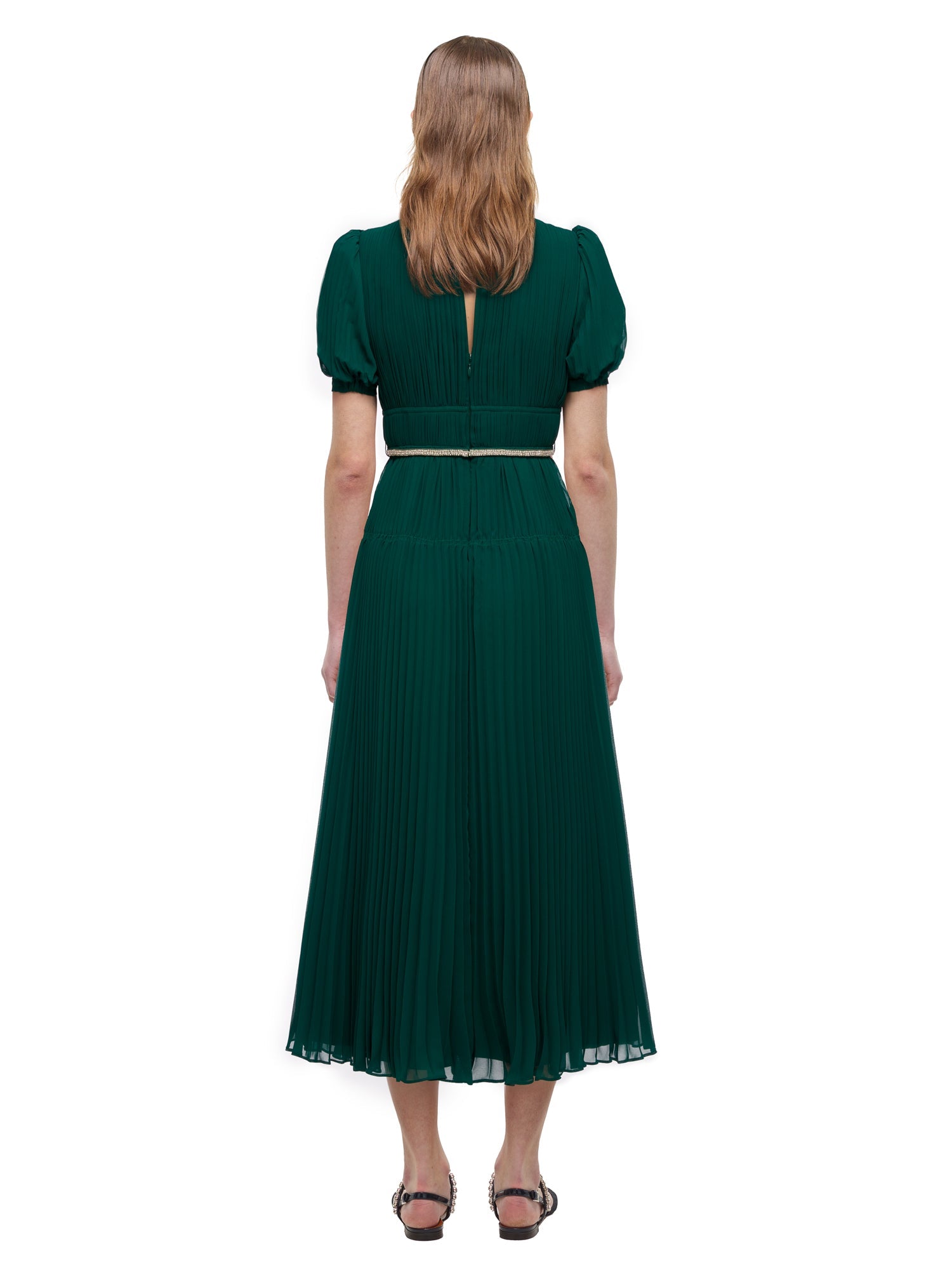 A woman wearing the Deep Green Chiffon Pleated Midi Dress