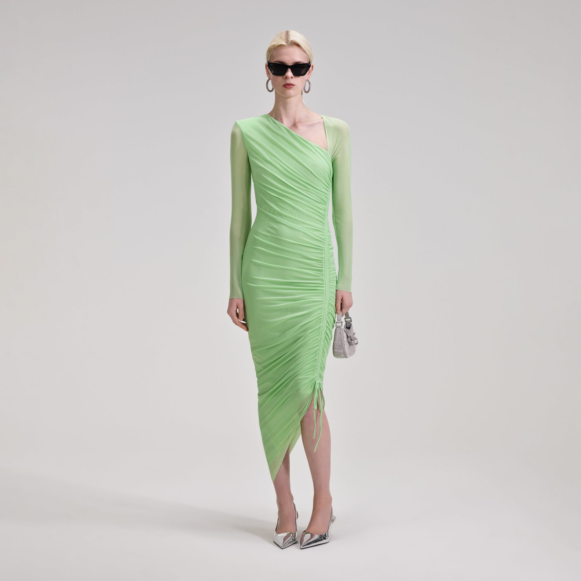 A woman wearing the Green Mesh Ruched Midi Dress