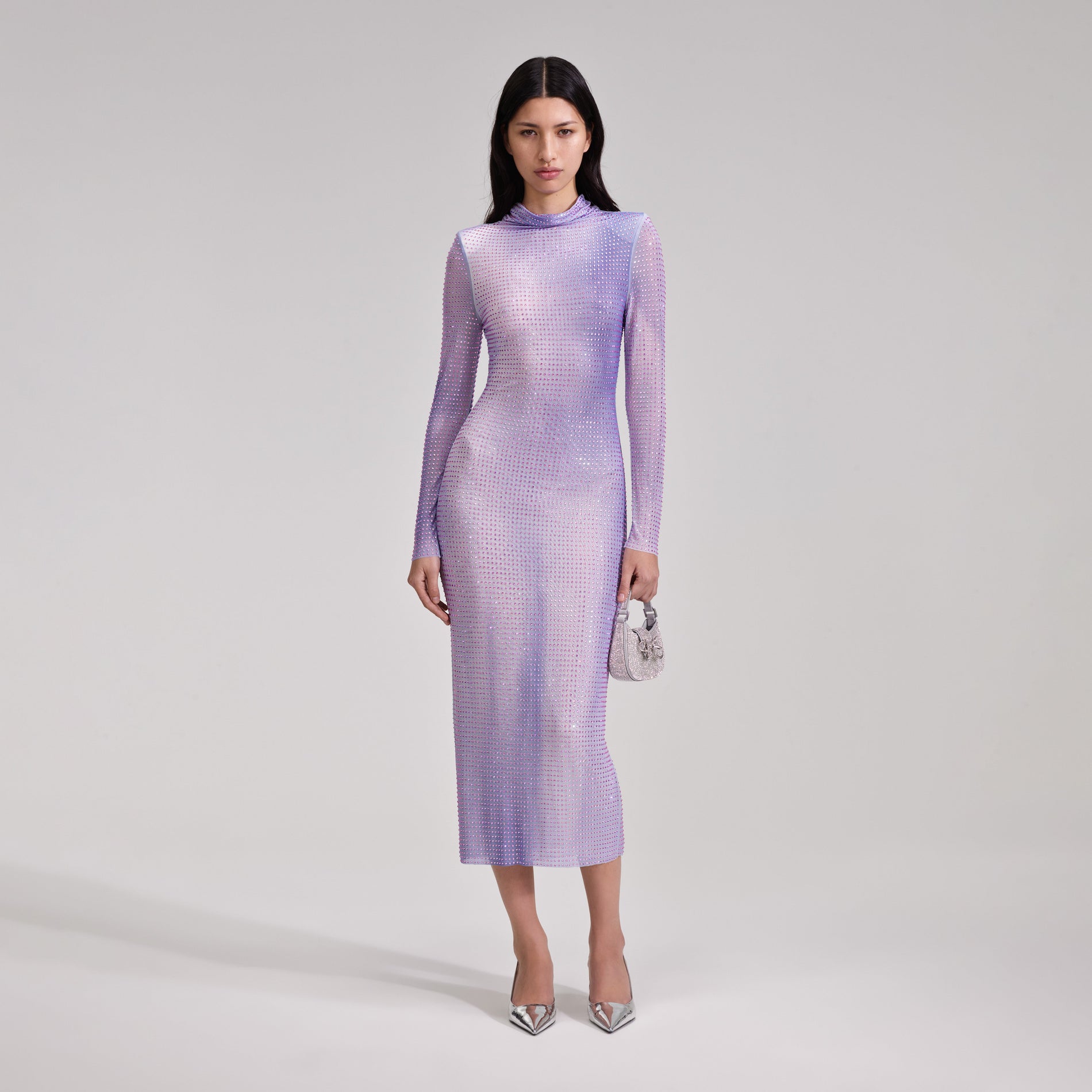 A woman wearing the Lilac Contour Print Midi Dress