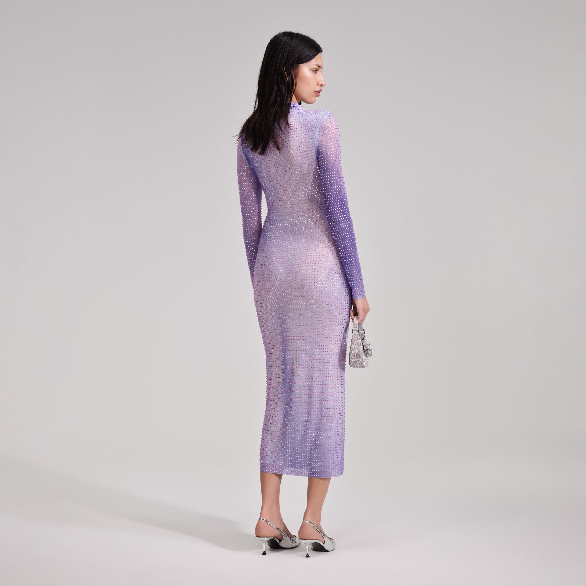 A woman wearing the Lilac Contour Print Midi Dress