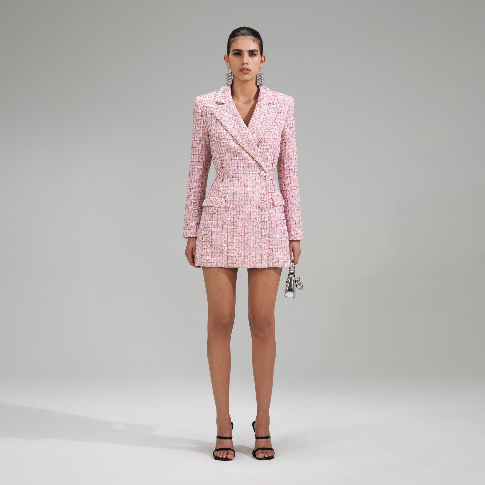 A woman wearing the Pink V Neck Boucle Tailored Mini Dress