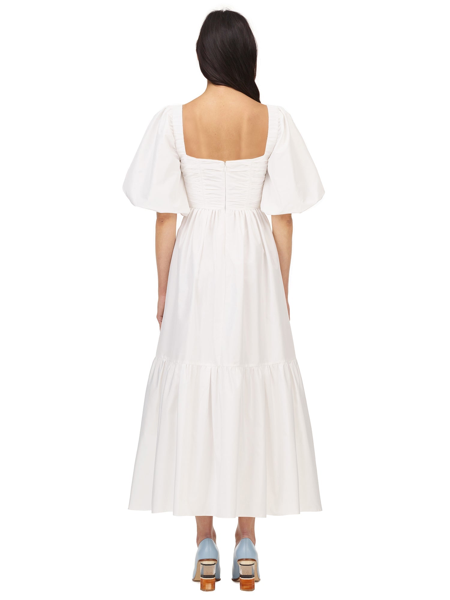 A woman wearing the White Taffeta Puff Sleeve Midi Dress