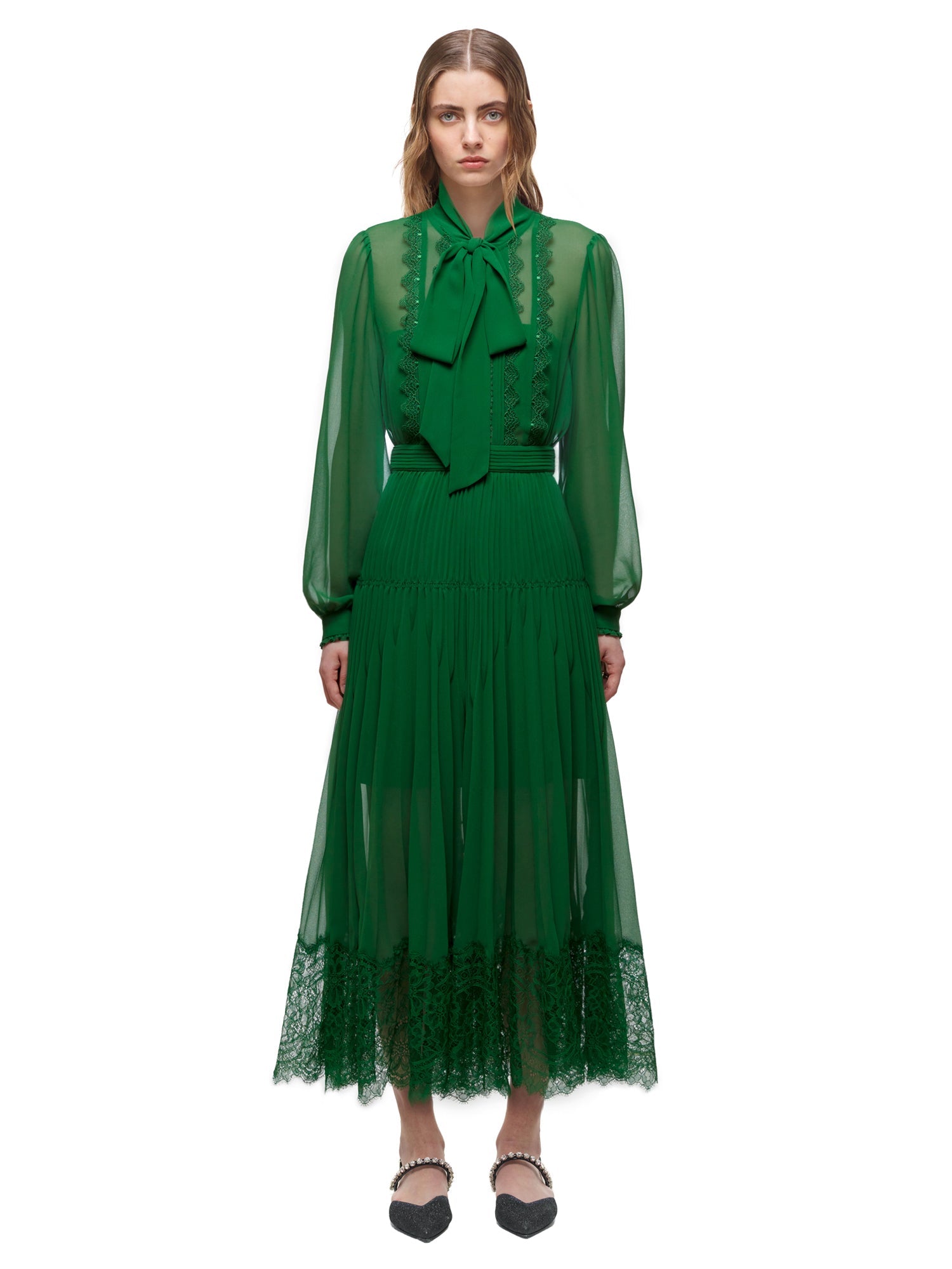 A woman wearing the Green Chiffon Trimmed Dress
