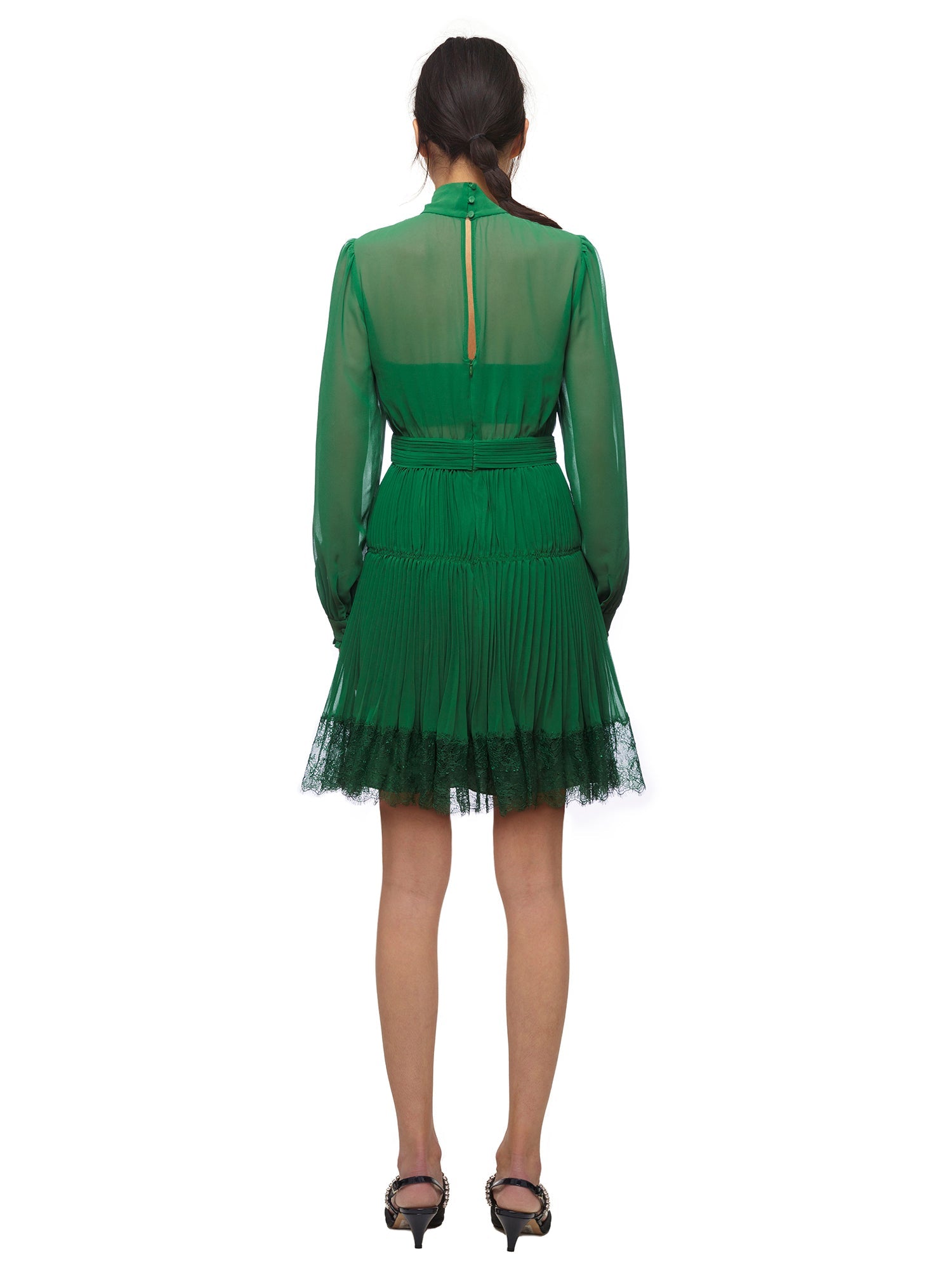 A woman wearing the Green Chiffon Mini Dress